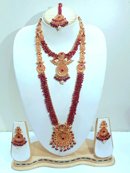 Yakshami Bridal jewellery set- golden necklace, choker, maang tikaand and drop earringsf with purple mani for women and girls